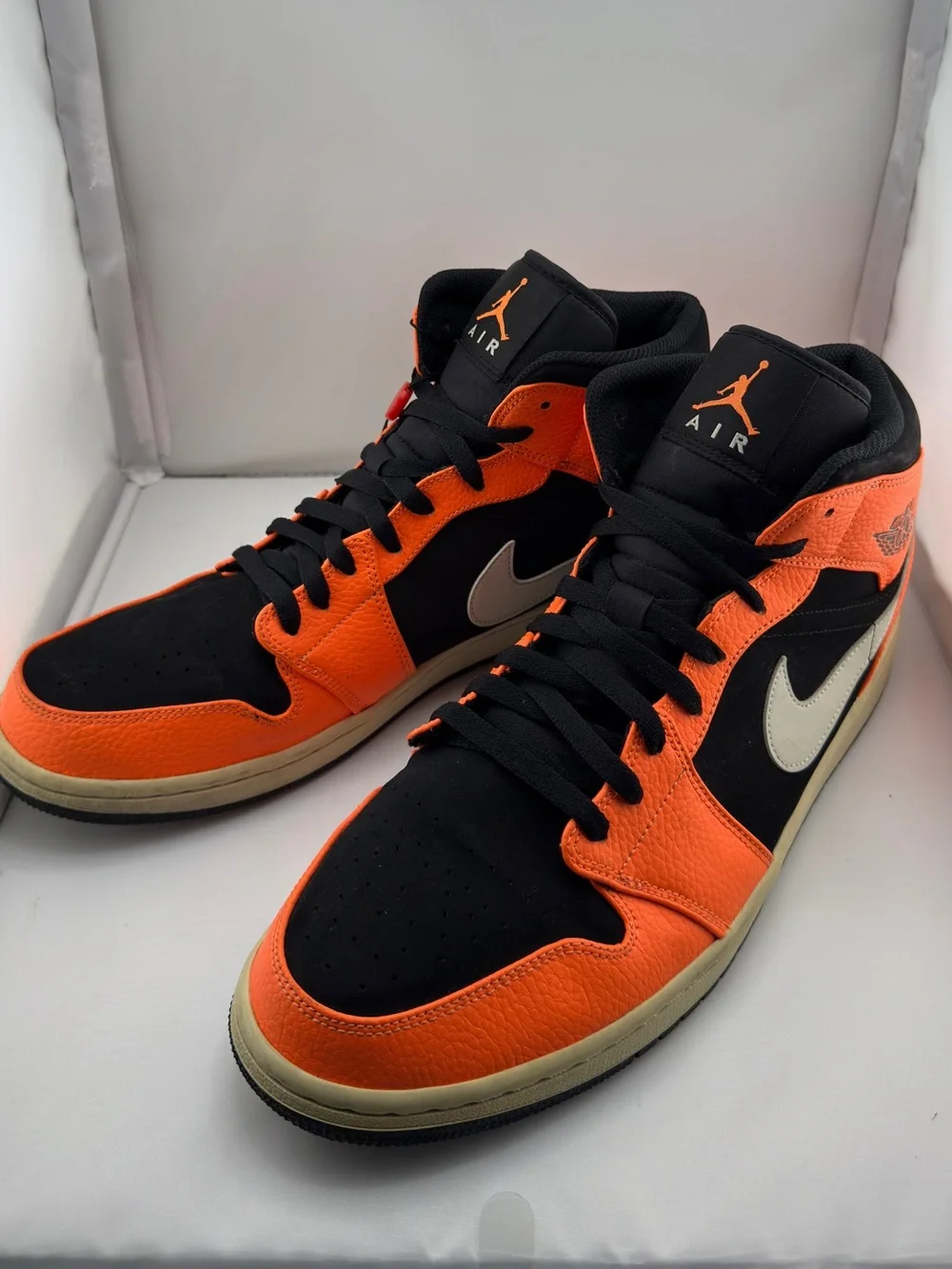 Jordan Black and Orange Mid-Top Sneakers with Cream Swoosh
